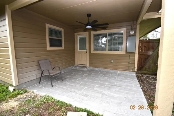 a view of house with backyard