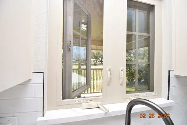 a front view of a door and a mirror