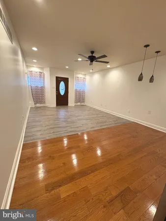 a view of a livingroom with a hall and a window