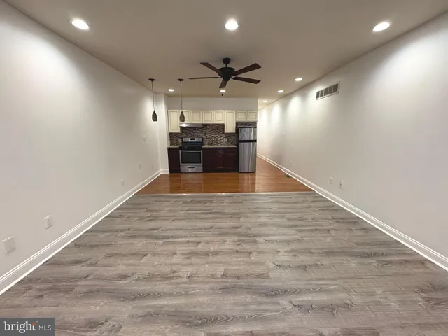 a view of a kitchen with a sink and a stove