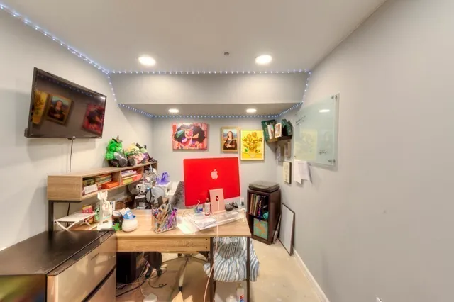 a view of a workspace with furniture