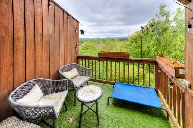 a view of a porch with furniture