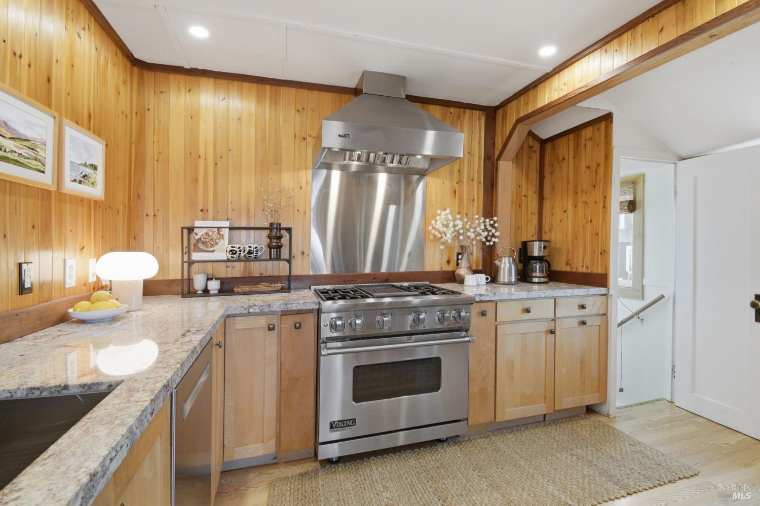 75 Ocean View Avenue Dillon Beach, CA 94929 - Photo 17 of 48 Stainless steel Viking range with hood, Bosch dishwasher, and entrance to lower level