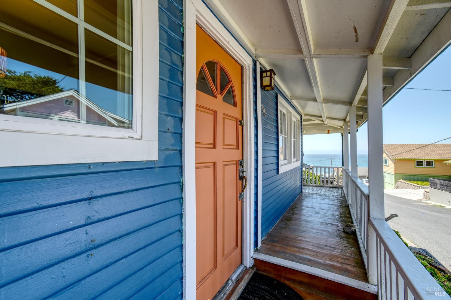 75 Ocean View Avenue Dillon Beach, CA 94929 - Photo 3 of 48 Covered wrap-around deck, entrance to main level, and ocean view