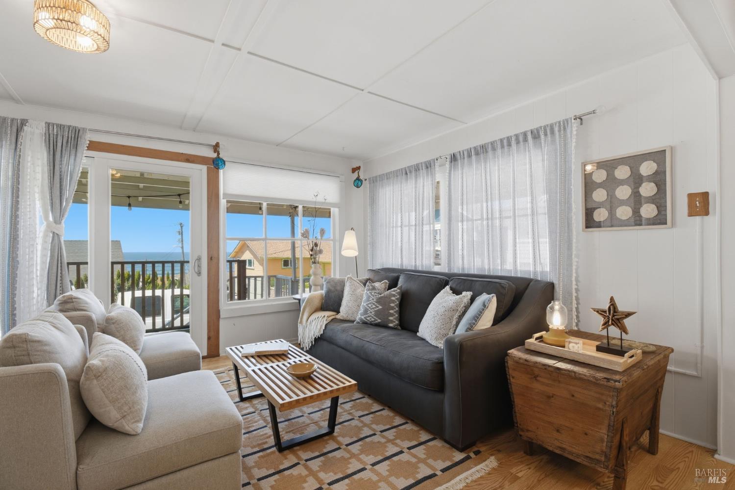 75 Ocean View Avenue Dillon Beach, CA 94929 - Photo 6 of 48 Living room with slider to wrap around deck and ocean view