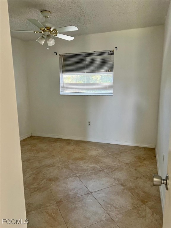 3325 Airport Road North, Unit S7 Naples, FL 34105 - Photo 5 of 7 a view of a ceiling fan in a room