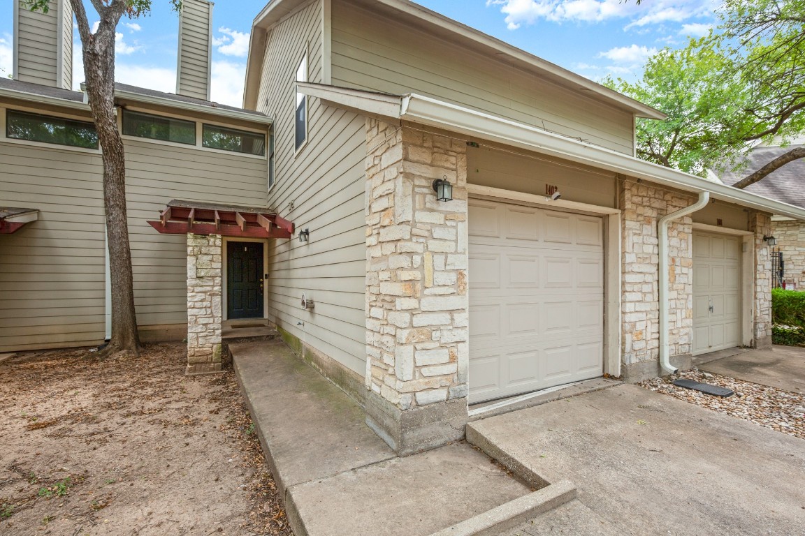 512 Eberhart Lane, Unit 1403 Austin, TX 78745 - Photo 1 of 15 a view of a house with garage