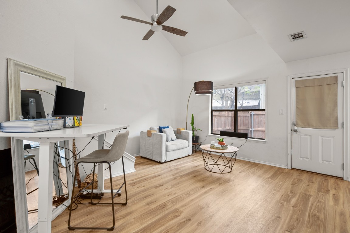 512 Eberhart Lane, Unit 1403 Austin, TX 78745 - Photo 2 of 15 a living room with furniture and a flat screen tv