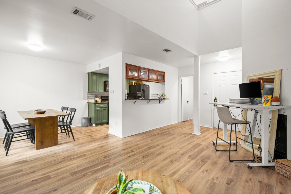 512 Eberhart Lane, Unit 1403 Austin, TX 78745 - Photo 5 of 15 a view of a livingroom with furniture and a flat screen tv