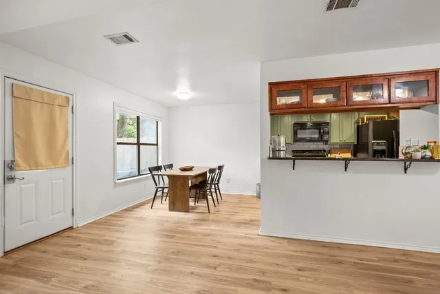 a view of kitchen with furniture and large window