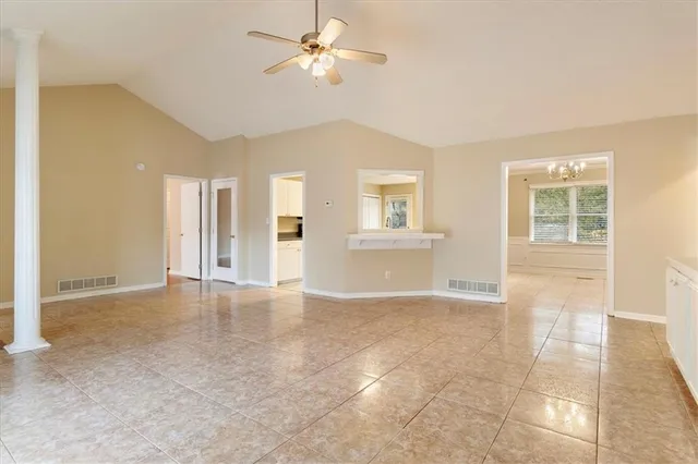 a view of an empty room with a window