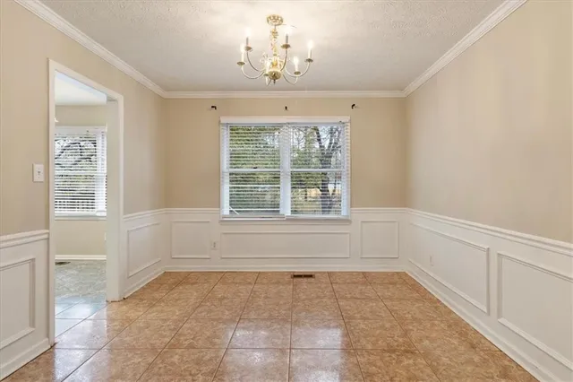 a view of a kitchen with a sink and dishwasher cabinets