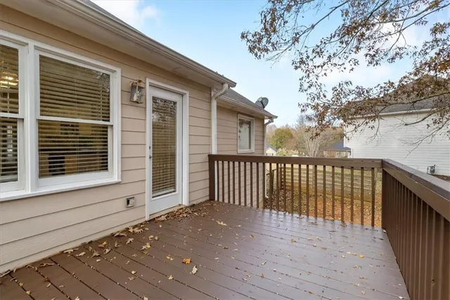 a view of a yard with trees in the background