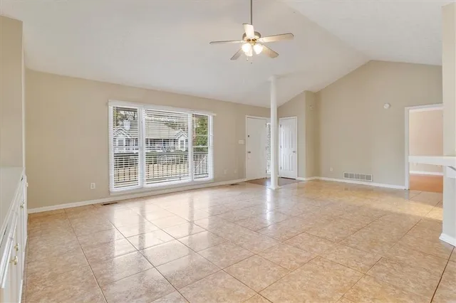 a view of an empty room with a window