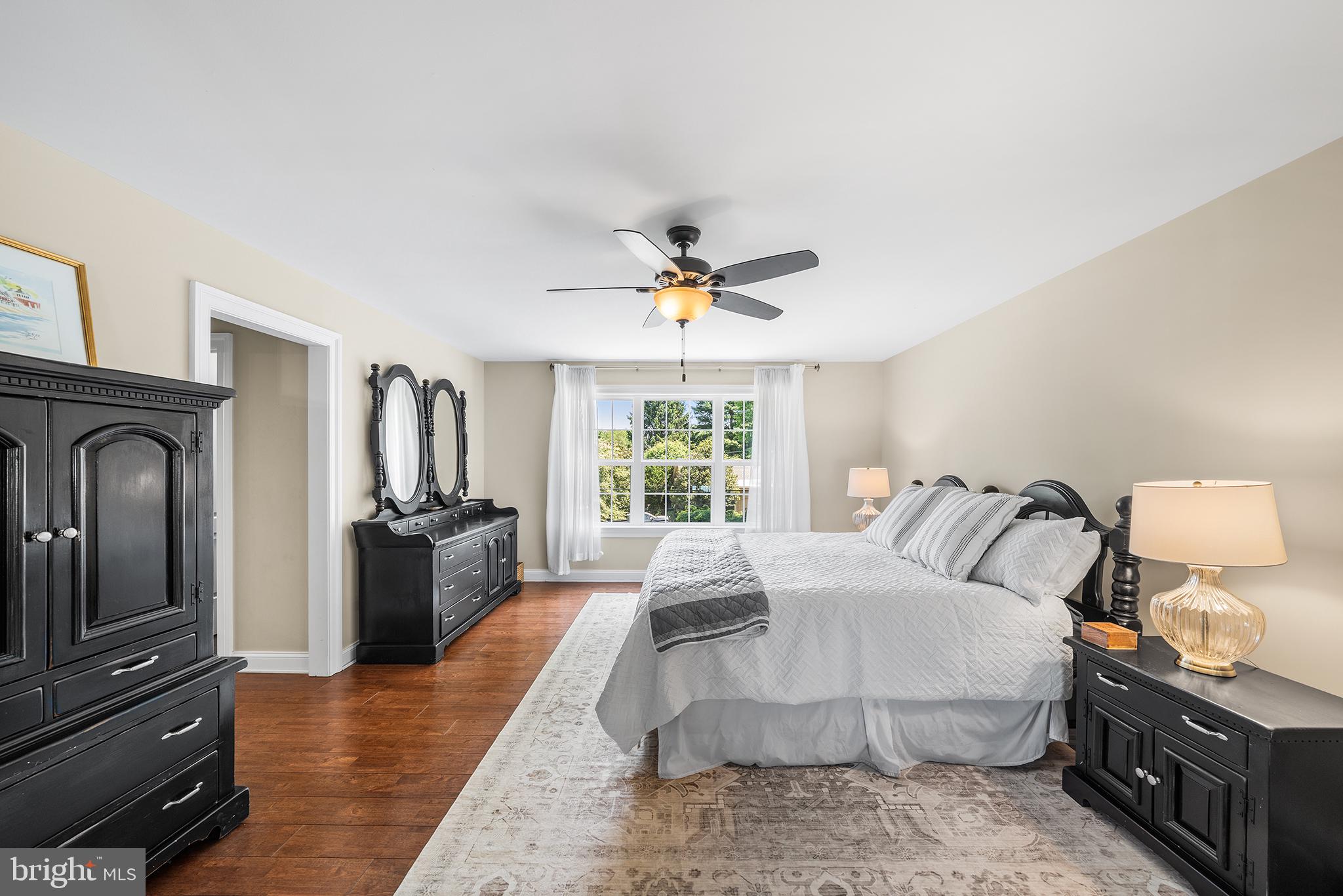 515 Old Eagle School Road Wayne, PA 19087 - Photo 20 of 40 a bedroom with a bed and wooden floor