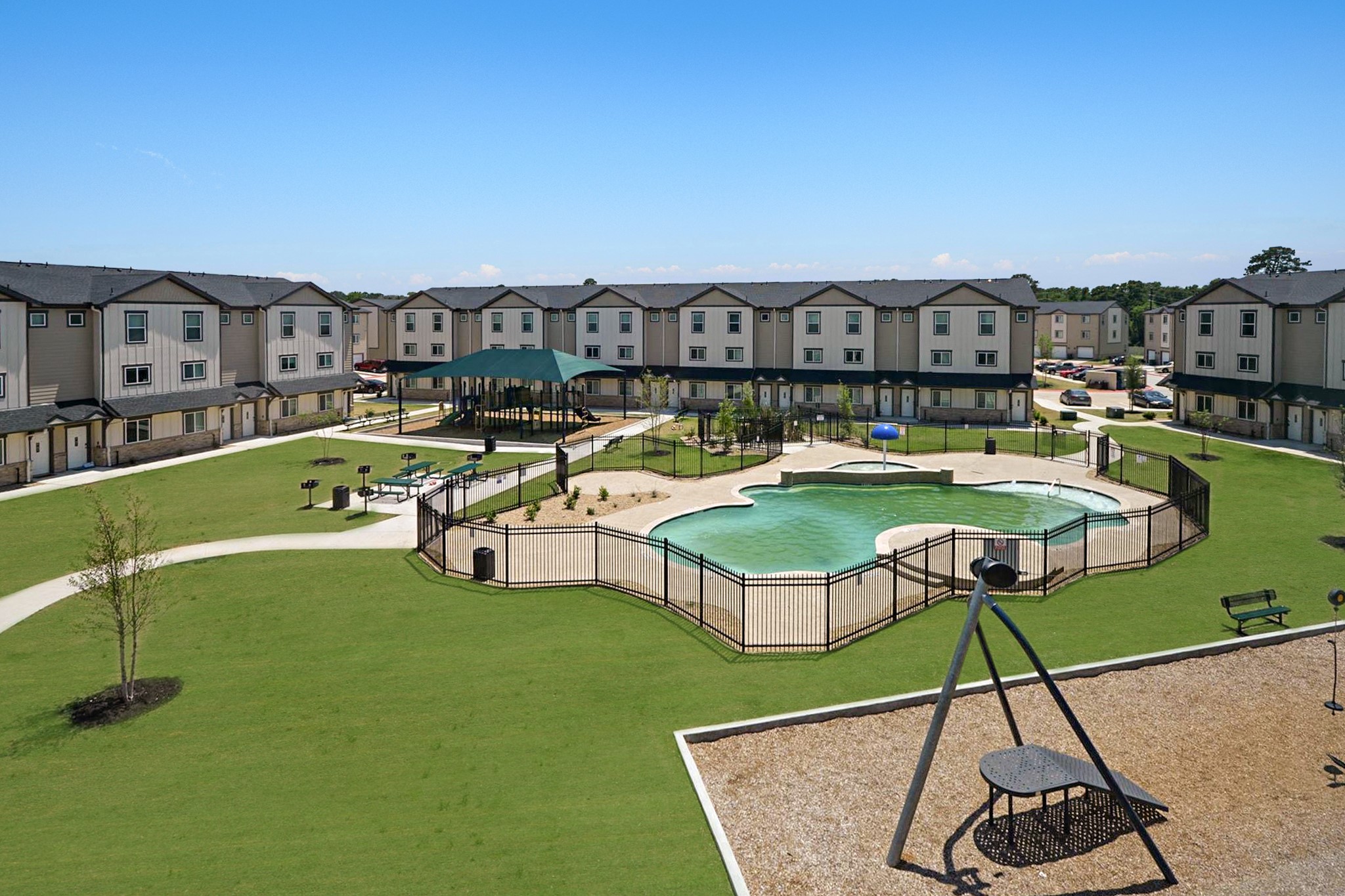 12603 Telge Road, Unit 8EH Cypress, TX 77429 - Photo 8 of 32 a view of a swimming pool with a chair and table