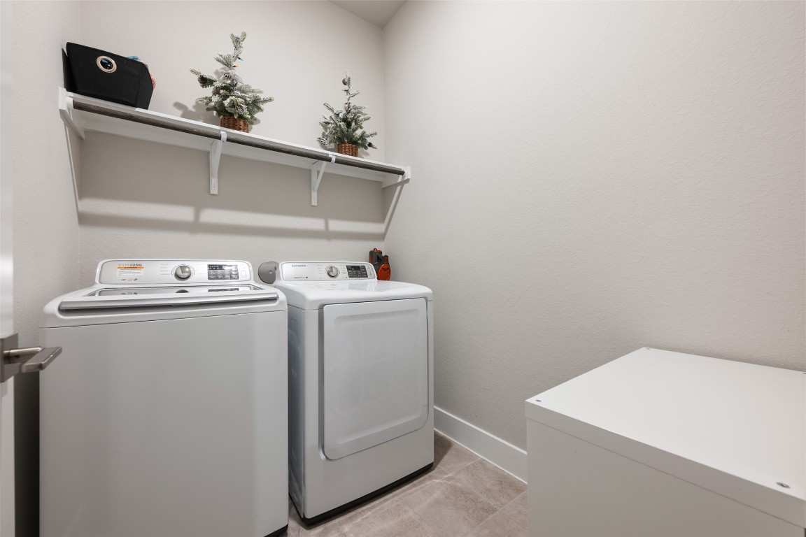 2212 Prairie Oaks Drive Georgetown, TX 78628 - Photo 33 of 39 a utility room with dryer and washer