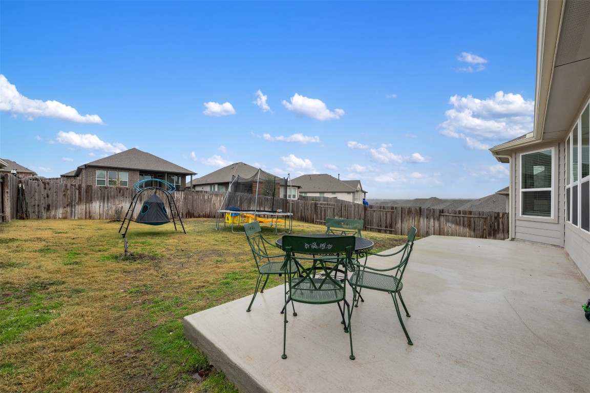 2212 Prairie Oaks Drive Georgetown, TX 78628 - Photo 34 of 39 a swimming pool with outdoor seating and yard