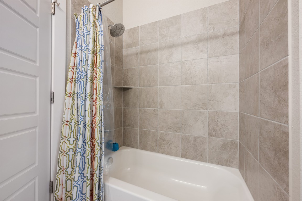2212 Prairie Oaks Drive Georgetown, TX 78628 - Photo 6 of 39 a bathroom with a bathtub and shower