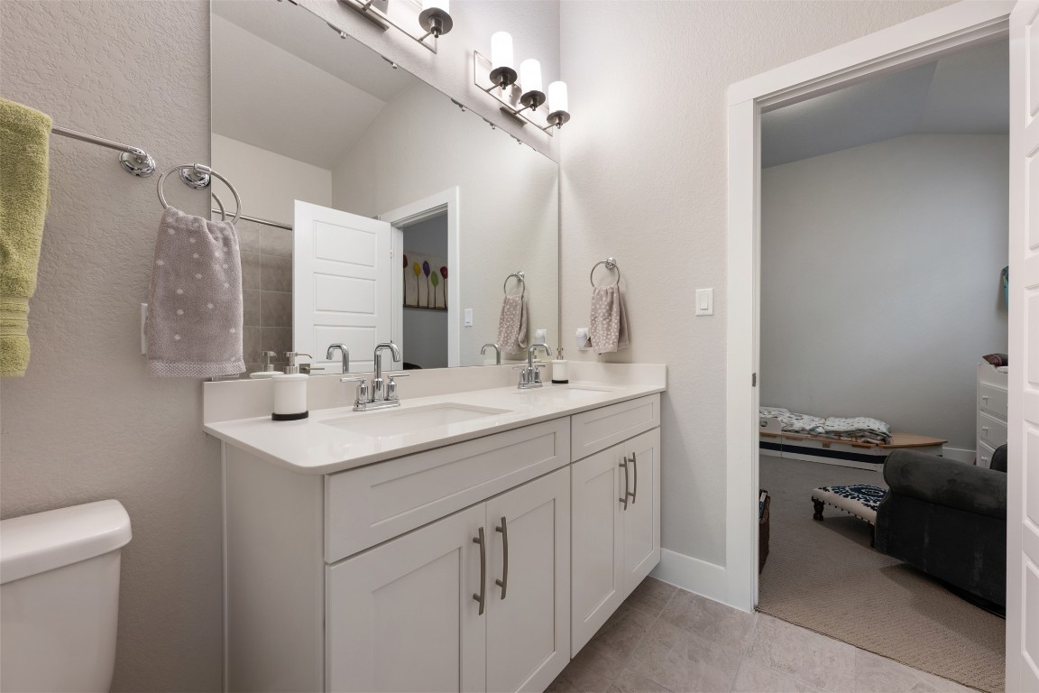 2212 Prairie Oaks Drive Georgetown, TX 78628 - Photo 7 of 39 a bathroom with a sink a toilet and a mirror