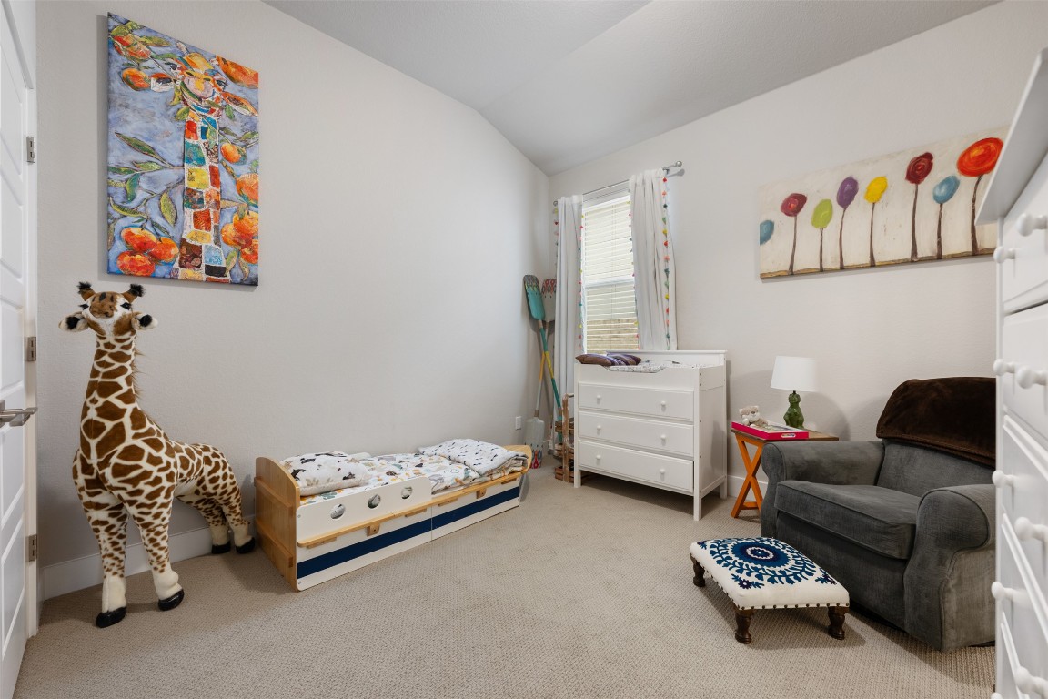 2212 Prairie Oaks Drive Georgetown, TX 78628 - Photo 8 of 39 a bedroom with furniture and a couch