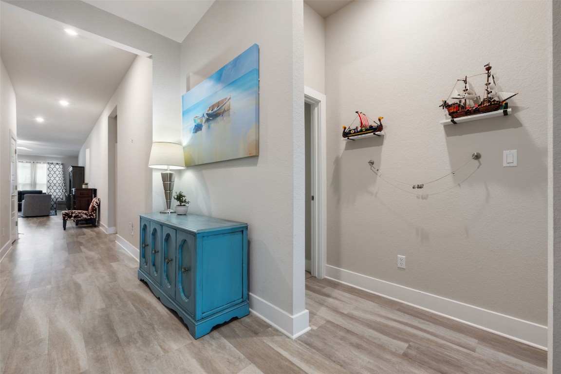 2212 Prairie Oaks Drive Georgetown, TX 78628 - Photo 9 of 39 a view of a kitchen from the hallway