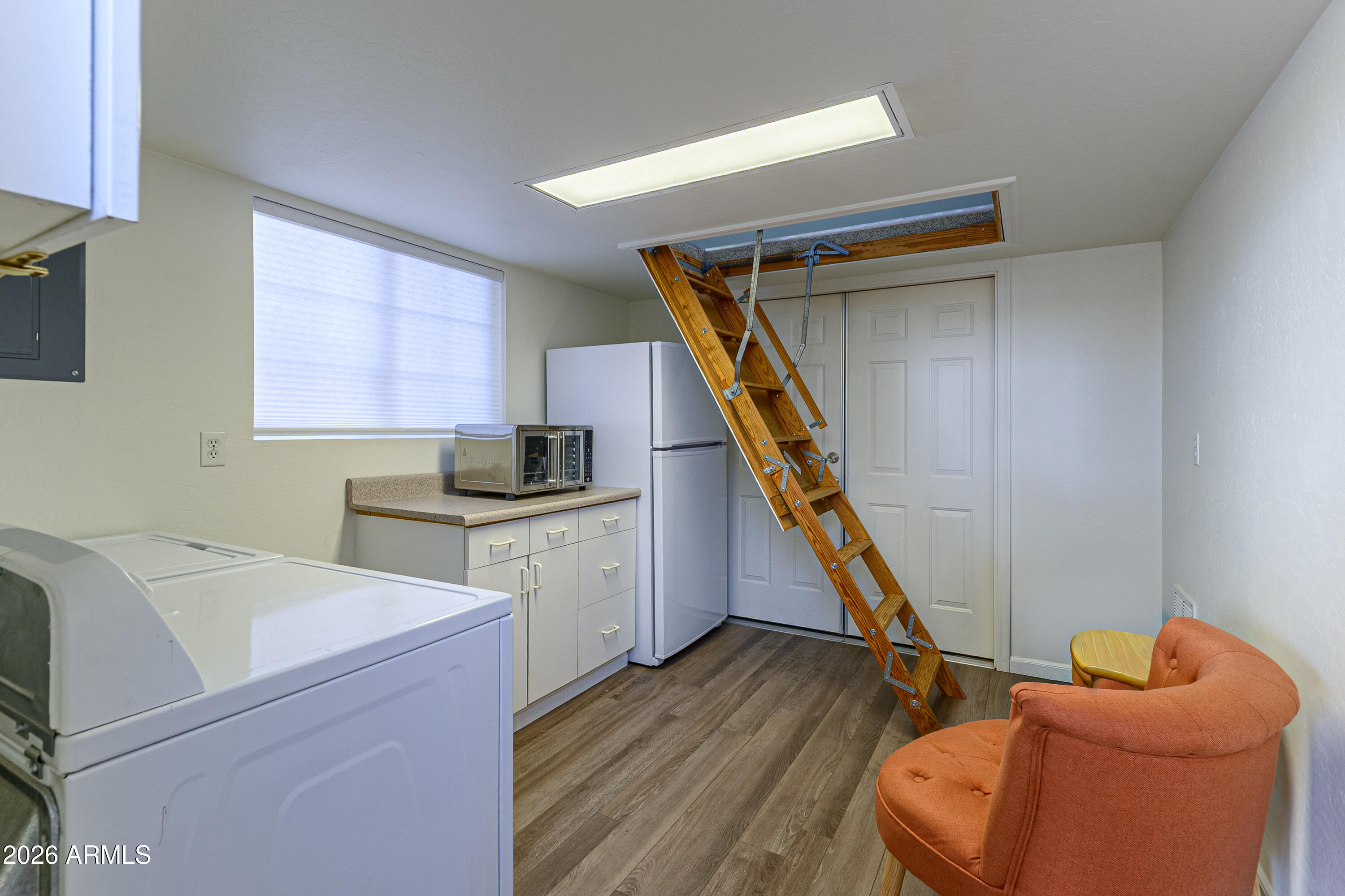 17200 West Bell Road, Unit 1052 Surprise, AZ 85374 - Photo 11 of 17 a storage room with wooden floor washer and dryer