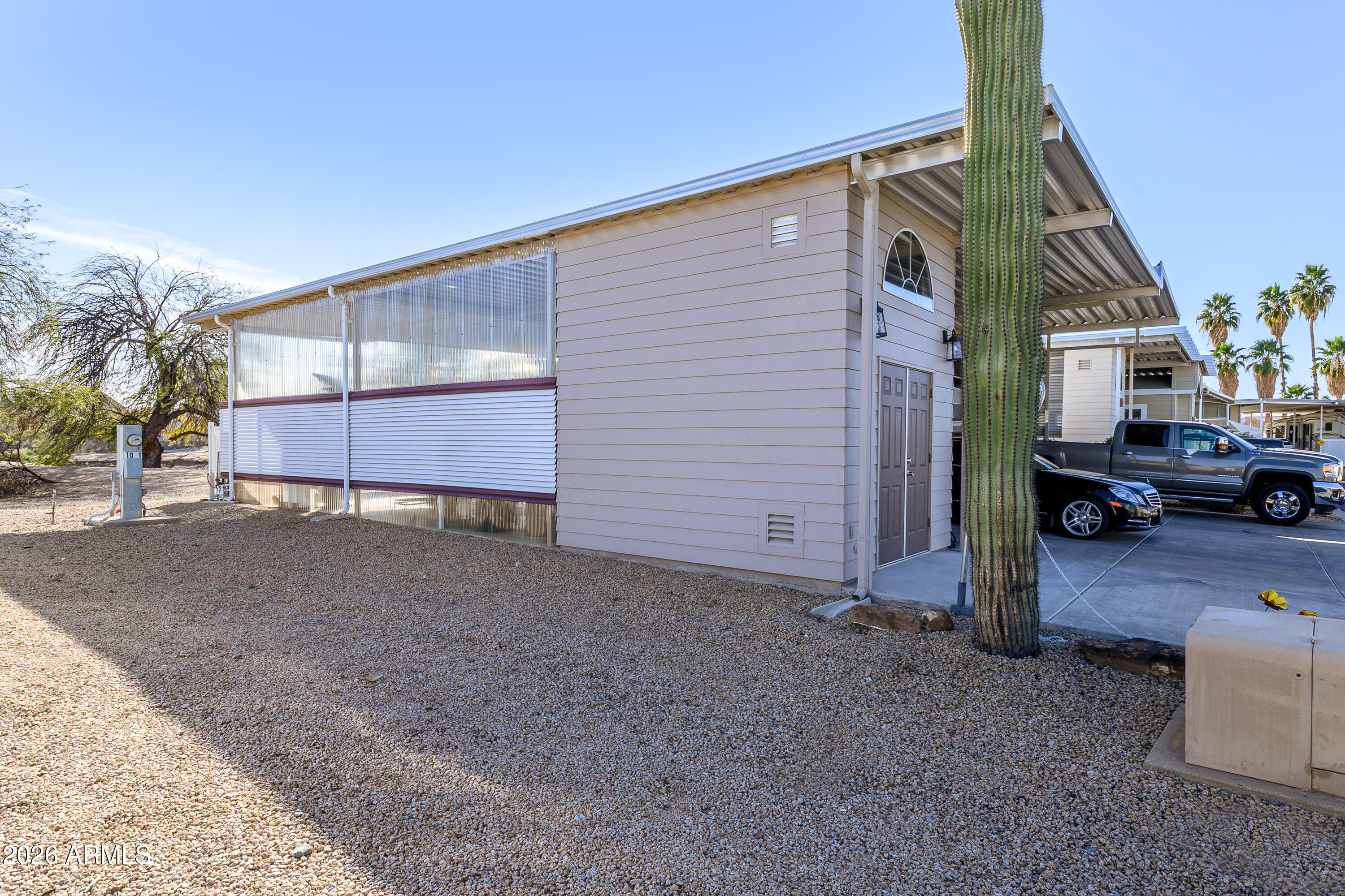 17200 West Bell Road, Unit 1052 Surprise, AZ 85374 - Photo 15 of 17 a view of a car park in front of house