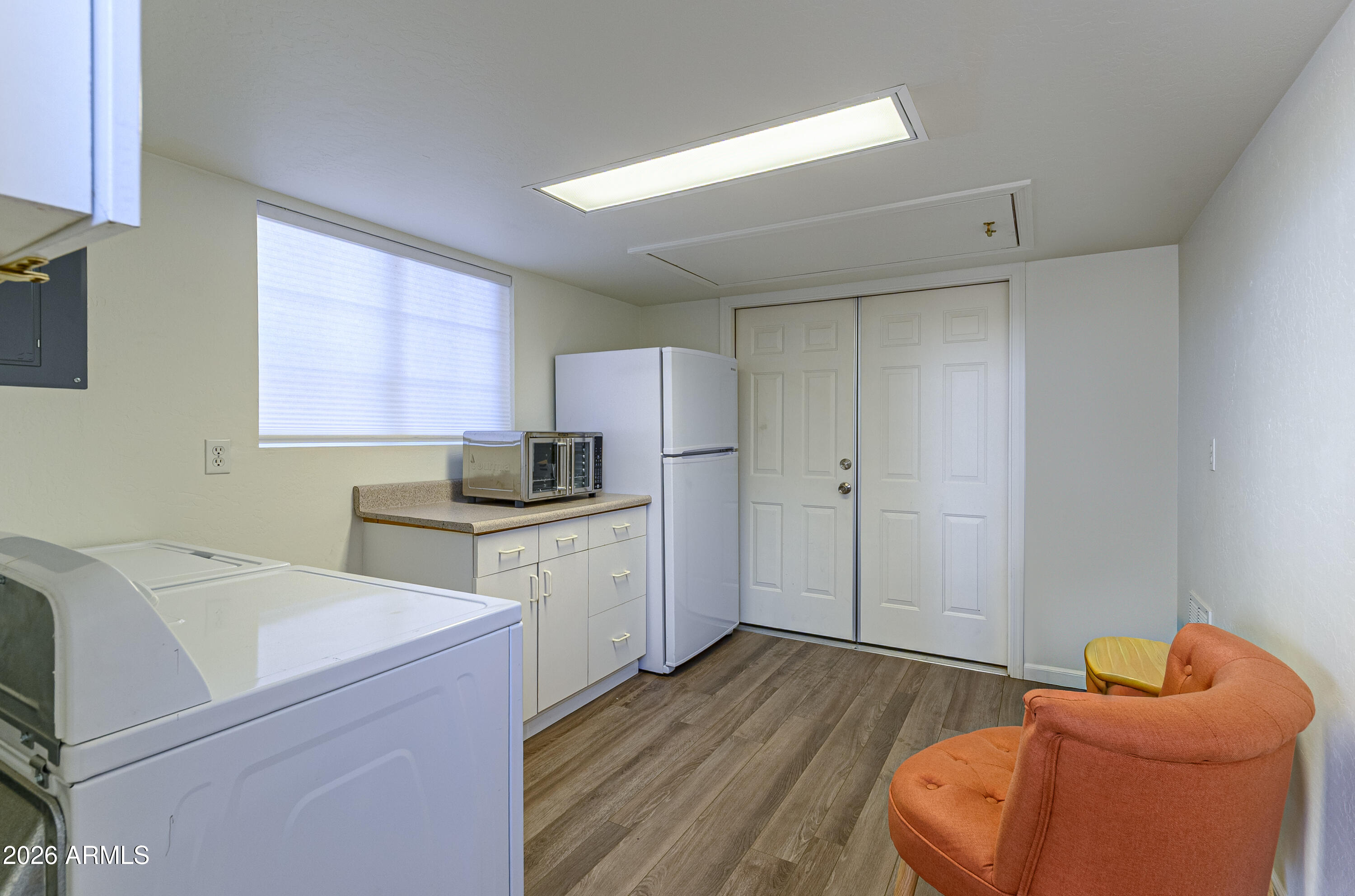 17200 West Bell Road, Unit 1052 Surprise, AZ 85374 - Photo 10 of 17 a room with furniture and a wooden floor