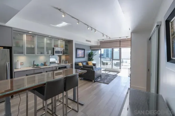 a kitchen with granite countertop lots of counter top space and stainless steel appliances
