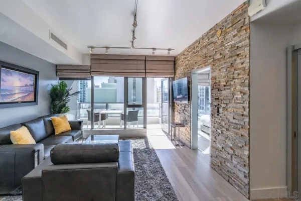 a living room with furniture and a large window