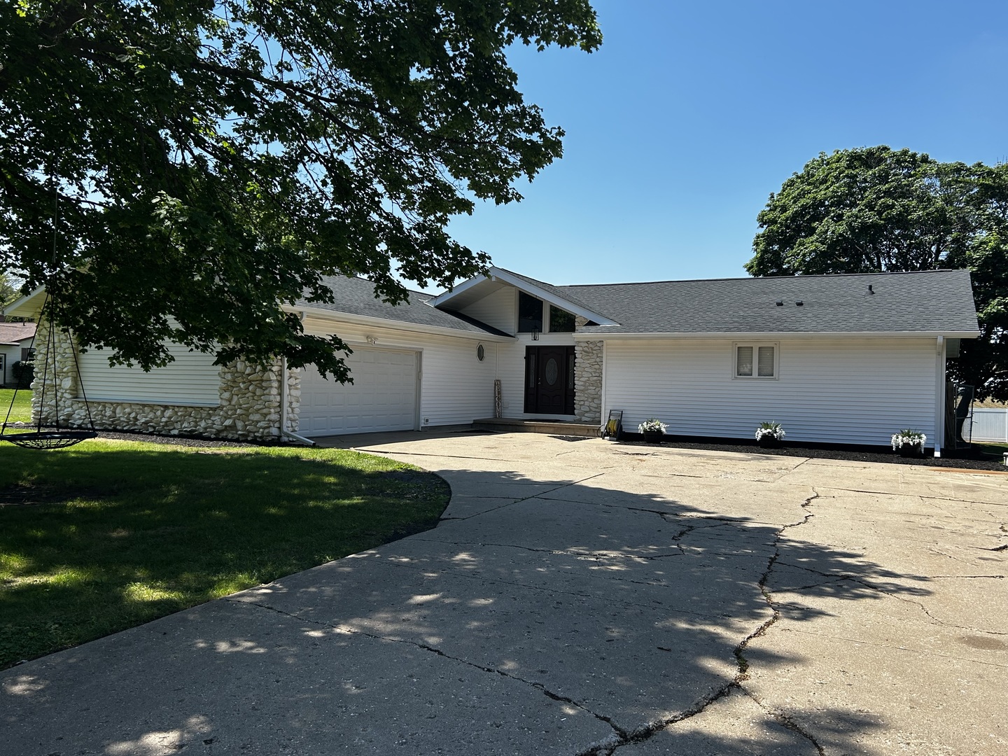 12795 Lawrence Road Sterling, IL 61081 - Photo 1 of 42 a front view of a house with a yard and garage