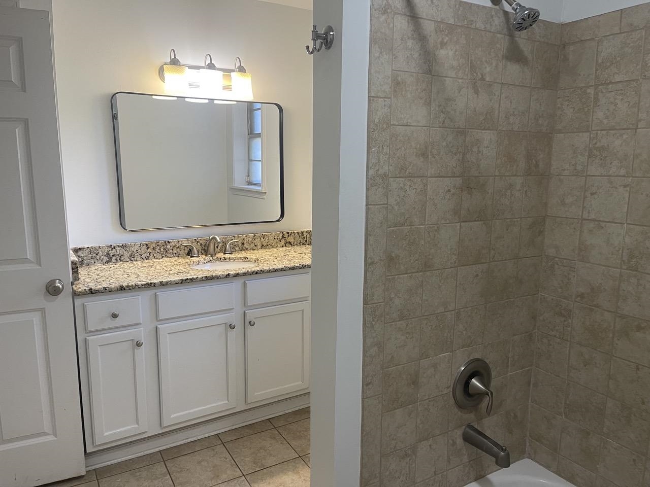 3320 Central Avenue Memphis, TN 38111 - Photo 15 of 22 a bathroom with a granite countertop sink and a mirror