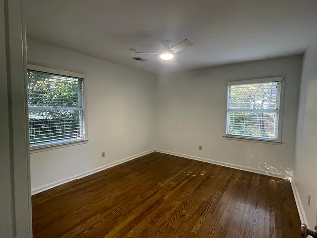 a view of a hallway with a furniture