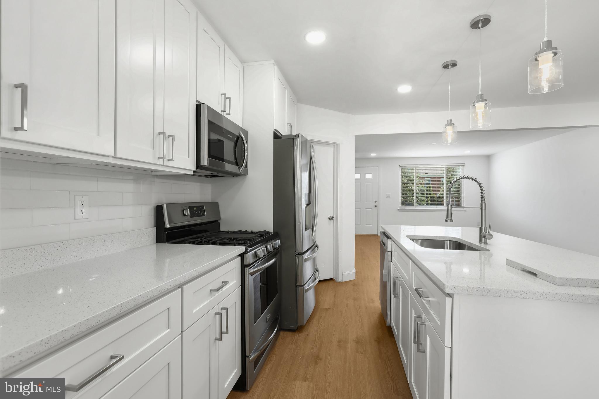 1714 Pin Oak Road Parkville, MD 21234 - Photo 15 of 41 Kitchen with backsplash & recessed lights