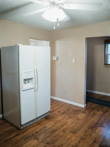 a white refrigerator freezer sitting in a kitchen