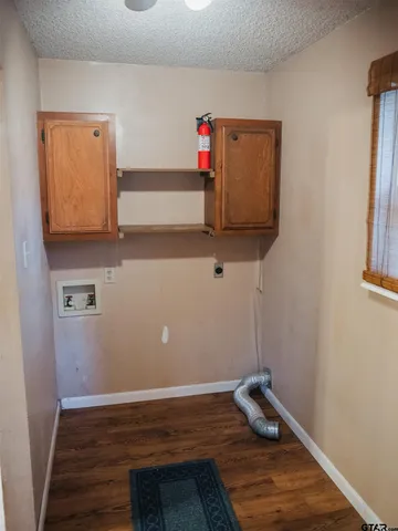 a room with stairs and wooden floor