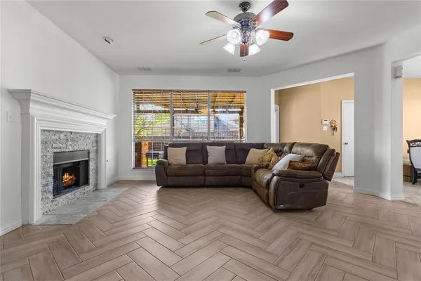 a living room with furniture and a fireplace