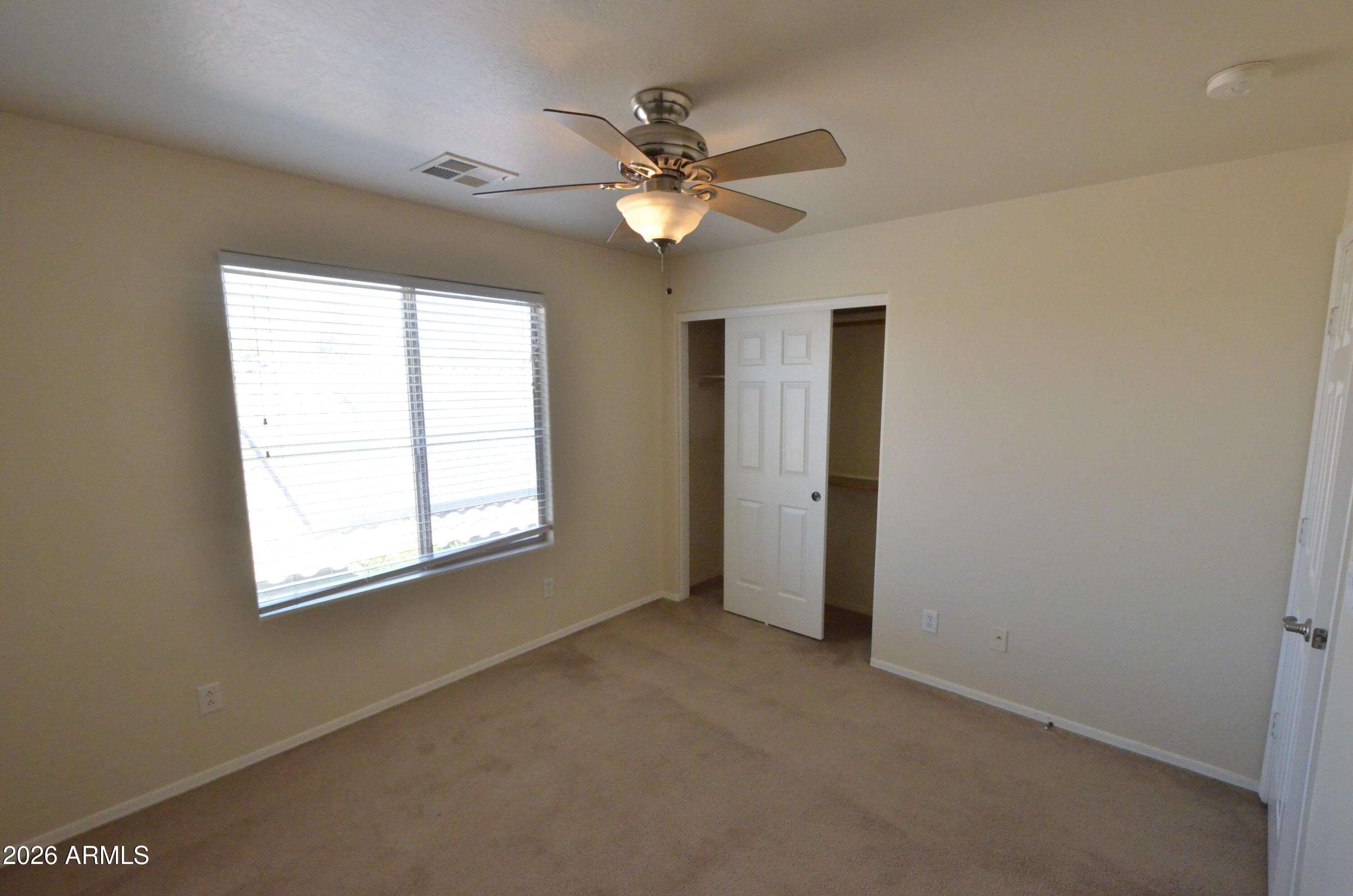 3995 East Trigger Way Gilbert, AZ 85297 - Photo 16 of 23 a view of a livingroom with a ceiling fan and window