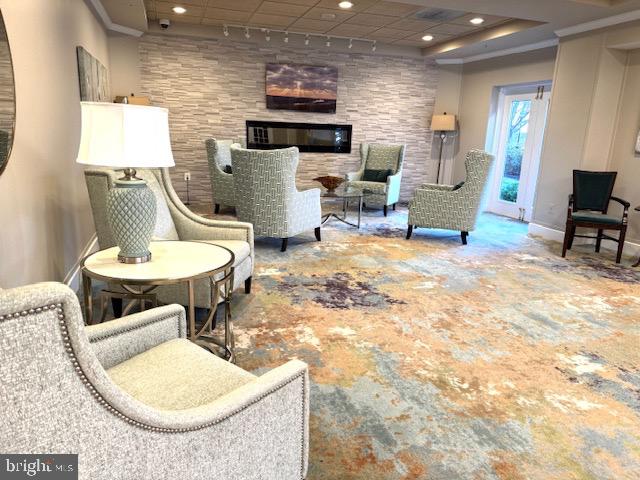 19355 Cypress Ridge Terrace, Unit 503 Leesburg, VA 20176 - Photo 15 of 22 a living room with furniture a window and a table