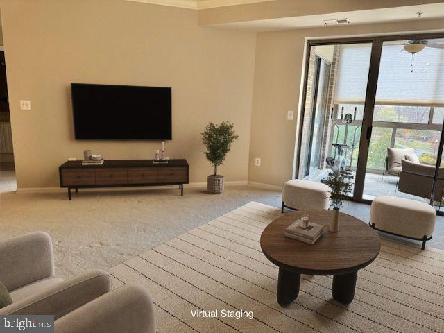 19355 Cypress Ridge Terrace, Unit 503 Leesburg, VA 20176 - Photo 4 of 22 a living room with furniture and a flat screen tv