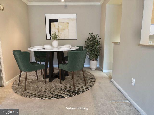 19355 Cypress Ridge Terrace, Unit 503 Leesburg, VA 20176 - Photo 5 of 22 a dining room with a table and chairs