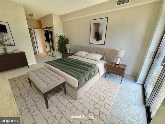 a bedroom with a bed and glass window