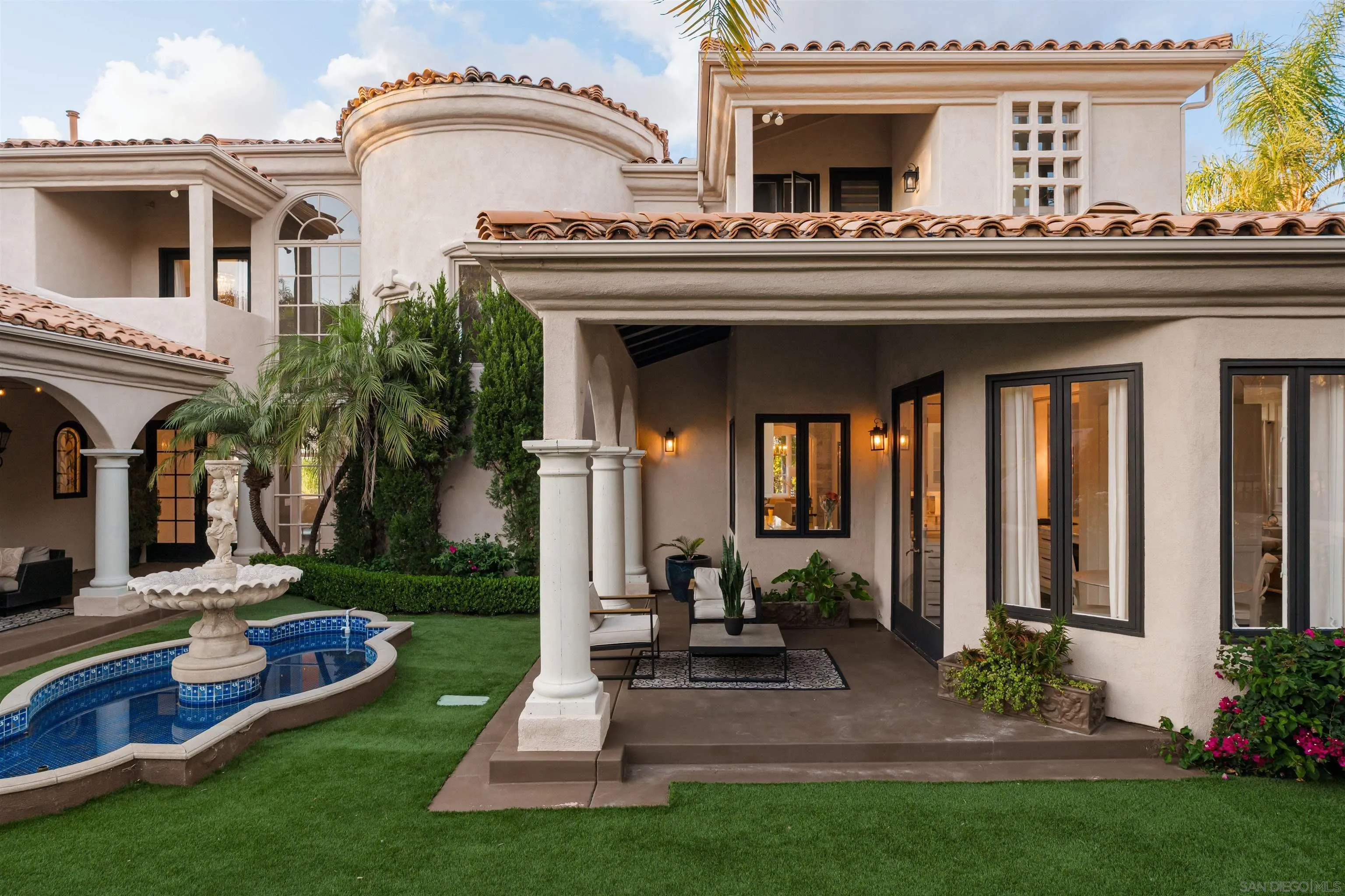 18136 Via Ascenso Rancho Santa Fe, CA 92067 - Photo 30 of 41 a view of a house with a porch and a fireplace