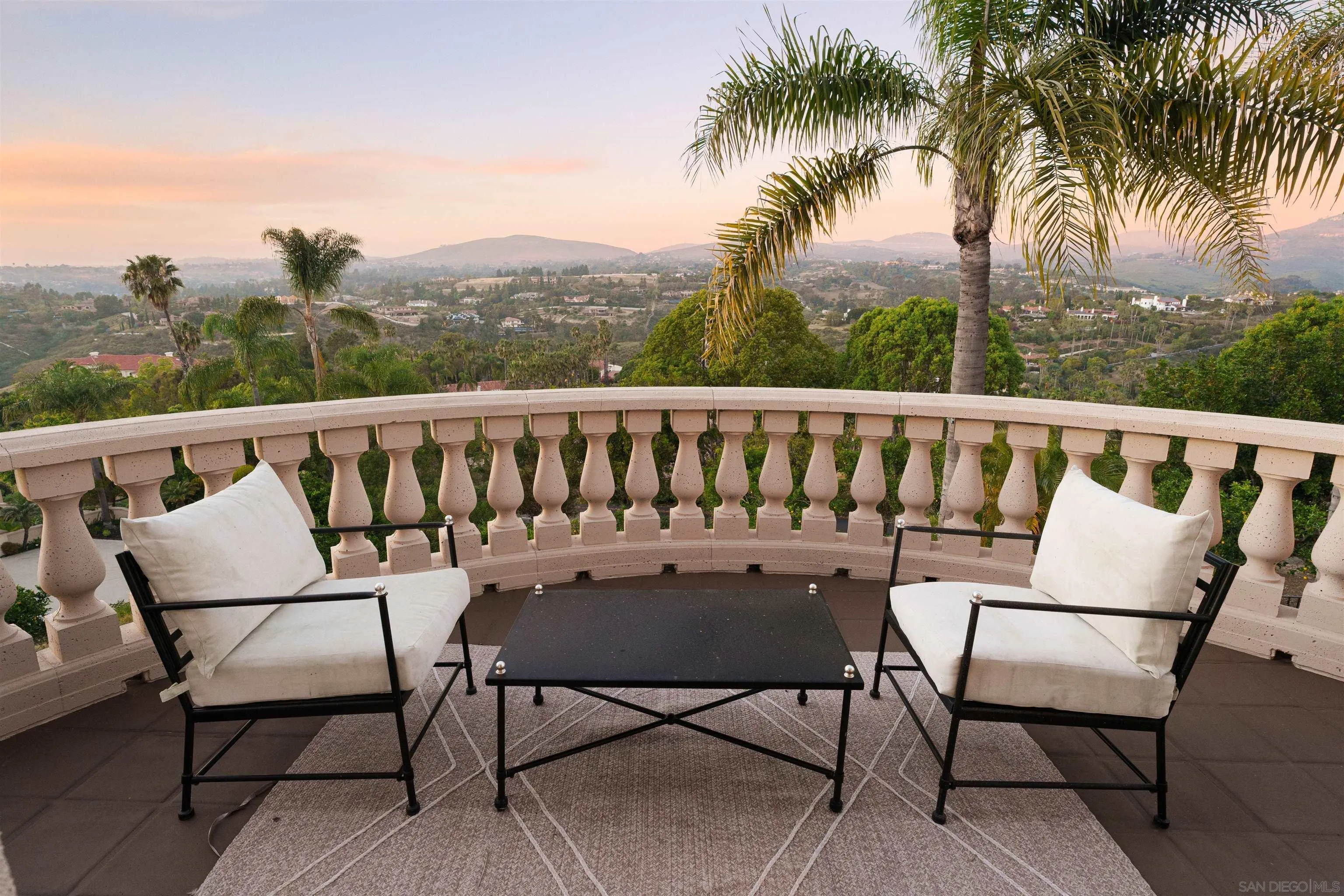 18136 Via Ascenso Rancho Santa Fe, CA 92067 - Photo 35 of 41 a balcony with outdoor seating and city view