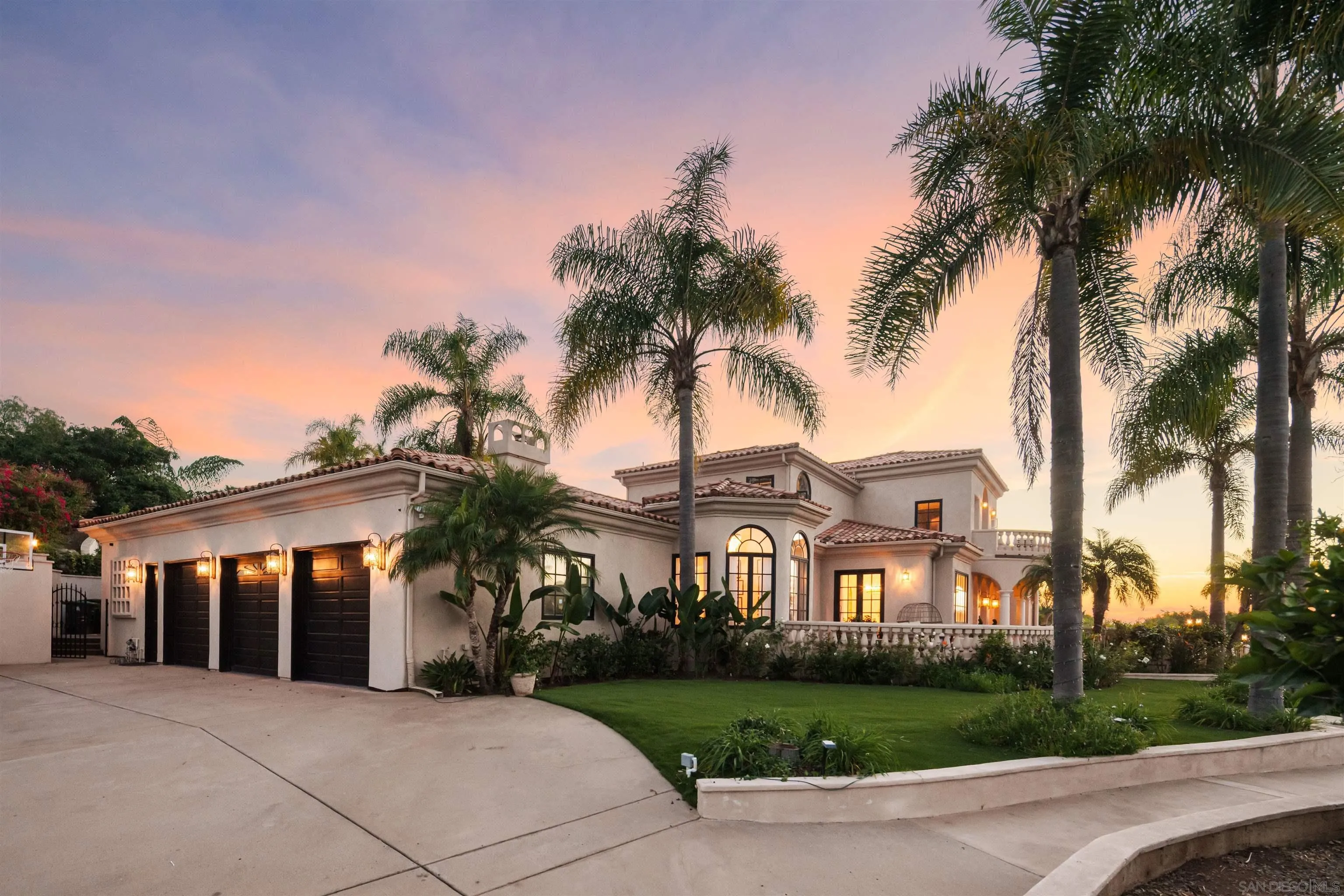 18136 Via Ascenso Rancho Santa Fe, CA 92067 - Photo 39 of 41 a front view of a house with a garden and trees