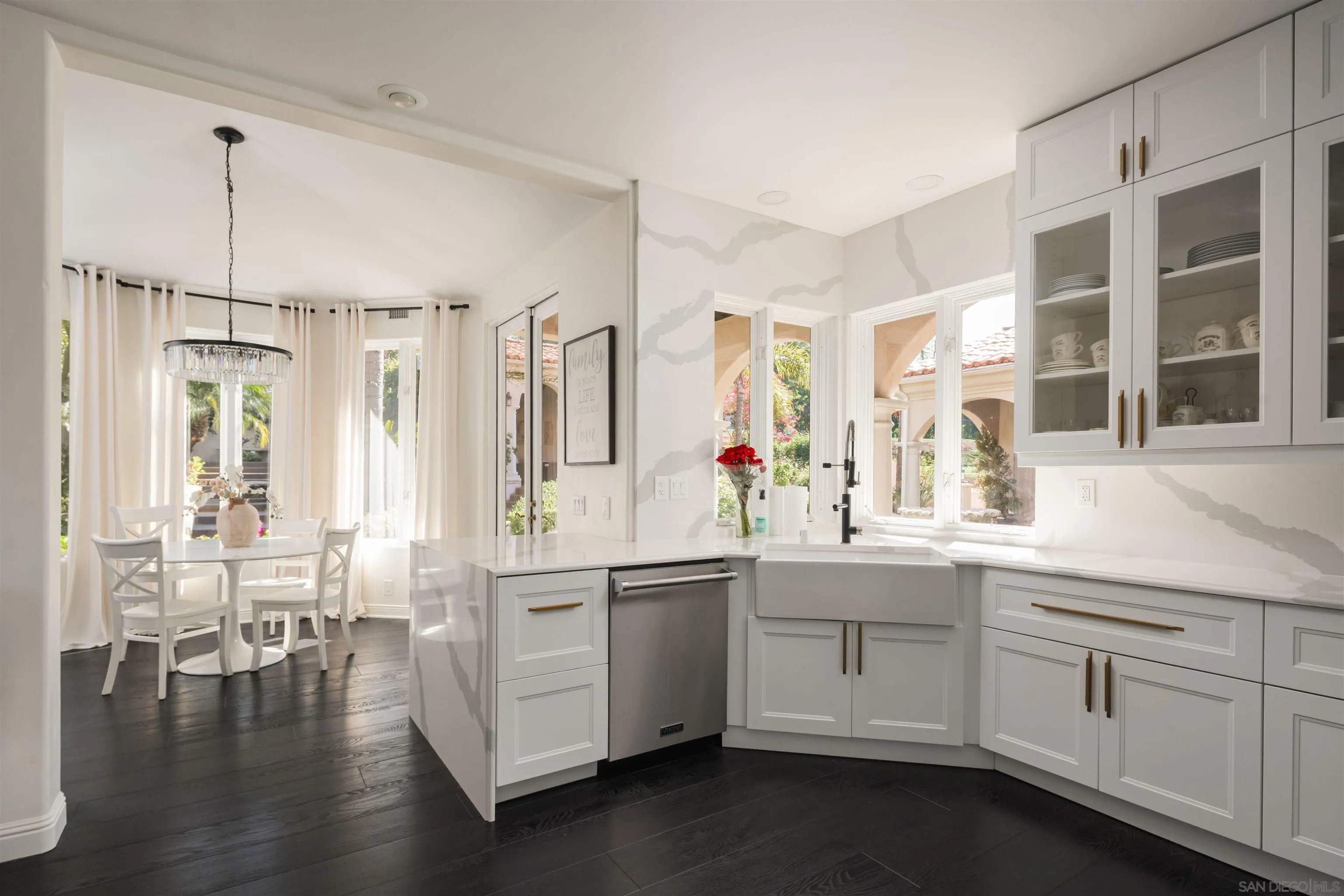 18136 Via Ascenso Rancho Santa Fe, CA 92067 - Photo 7 of 41 a kitchen with white cabinets and sink