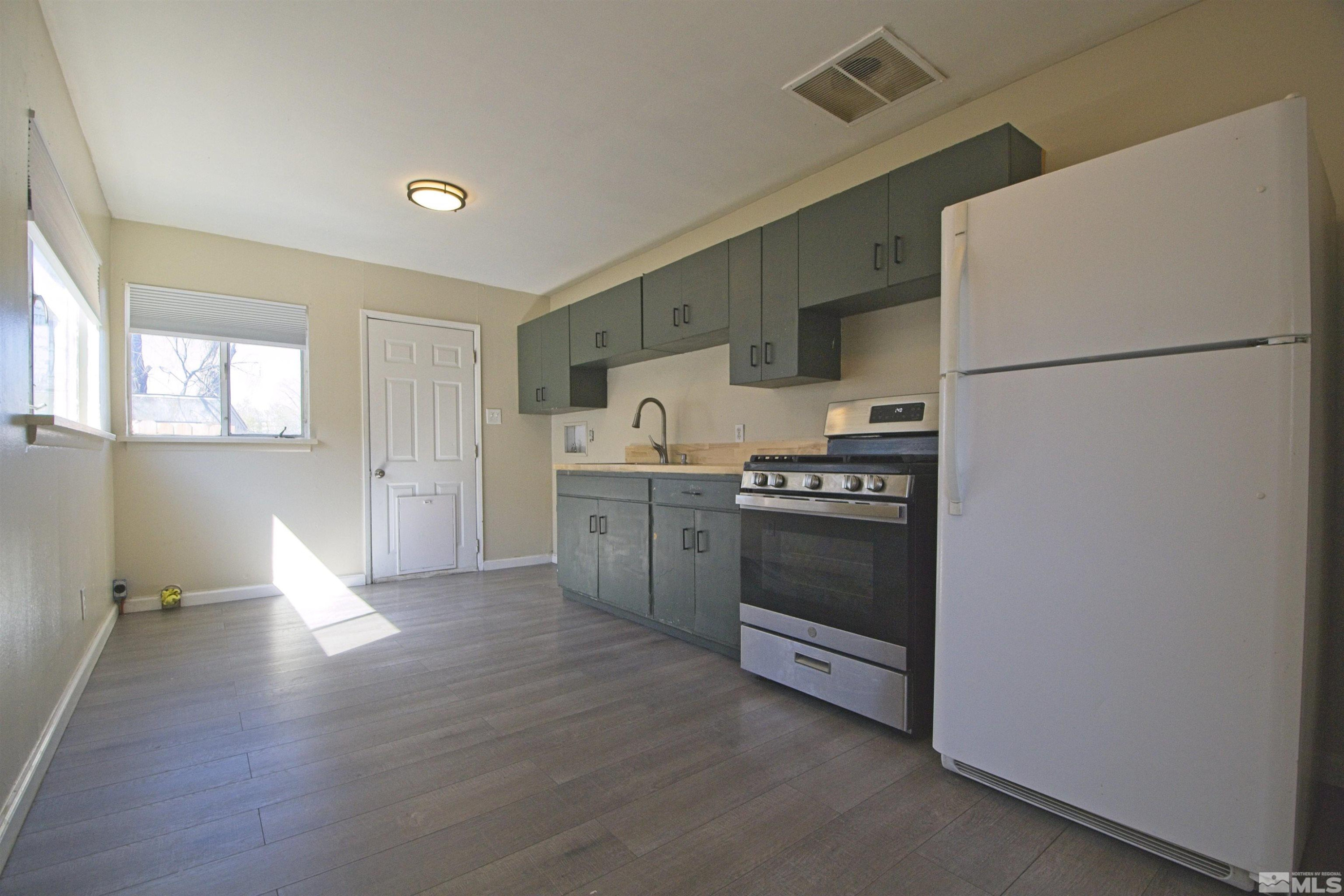 2516 D Street Sparks, NV 89431 - Photo 4 of 9 a kitchen with stainless steel appliances a refrigerator sink and cabinets