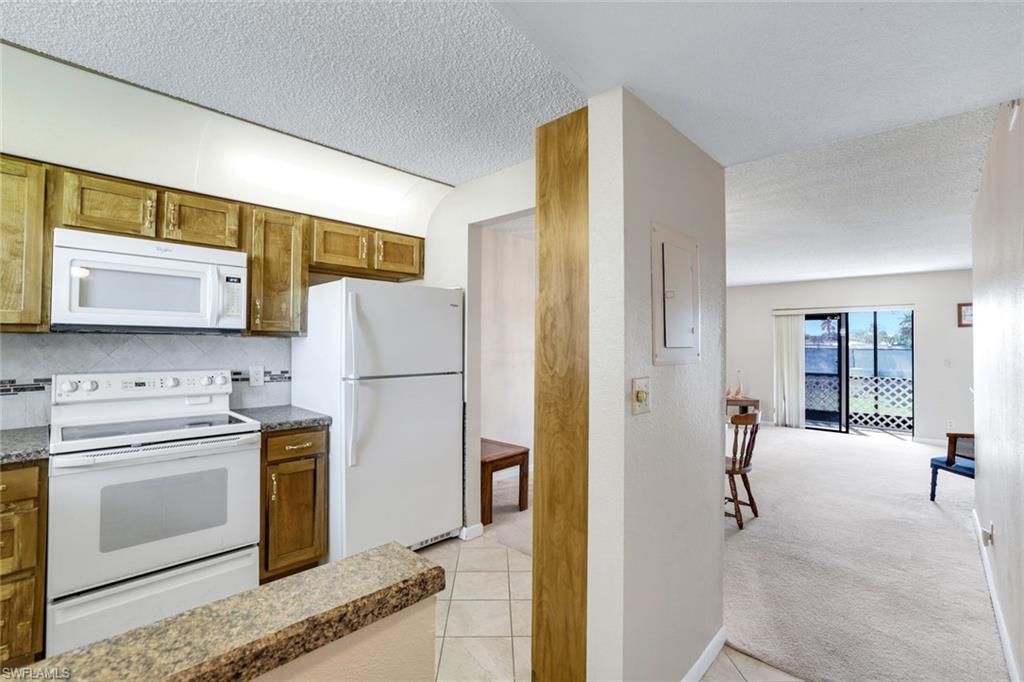 4338 27th Court Southwest, Unit 104 Naples, FL 34116 - Photo 2 of 24