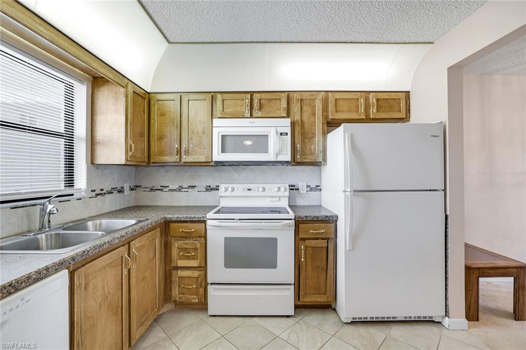 4338 27th Court Southwest, Unit 104 Naples, FL 34116 - Photo 3 of 24